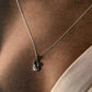 Minimalist silver cat necklace with smooth, polished finish