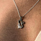 Elegant silver cat pendant hanging from a fine chain