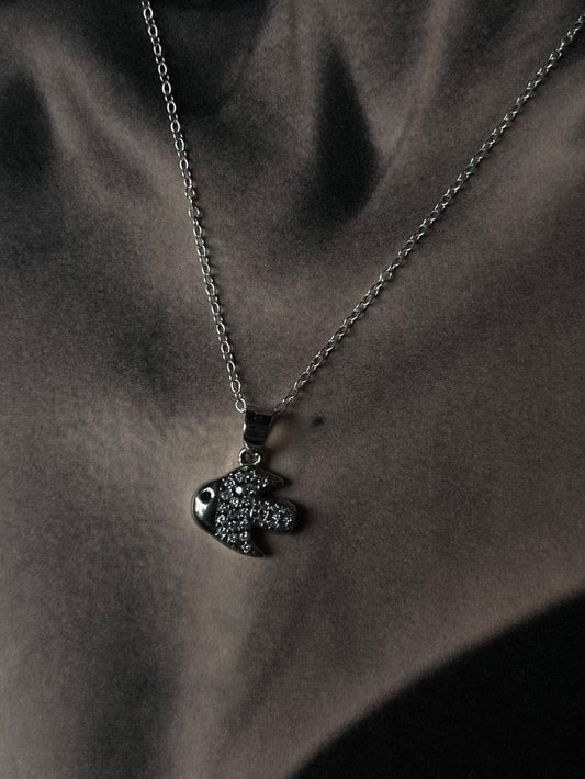 Elegant fish-shaped silver necklace with intricate detailing