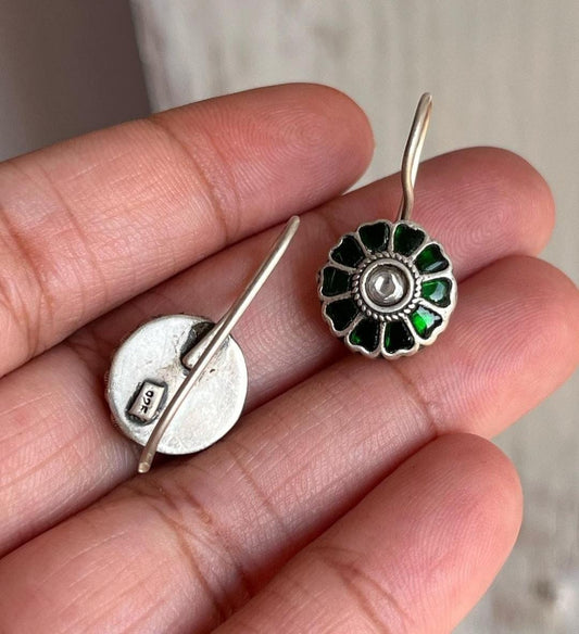 Green and white Kundan silver earrings with intricate design