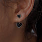 Charming black enamel heart-shaped silver studs for a bold look.