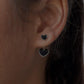 Minimalist black heart enamel silver studs with a smooth finish.