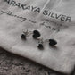 Timeless silver studs featuring black heart enamel for a chic touch.