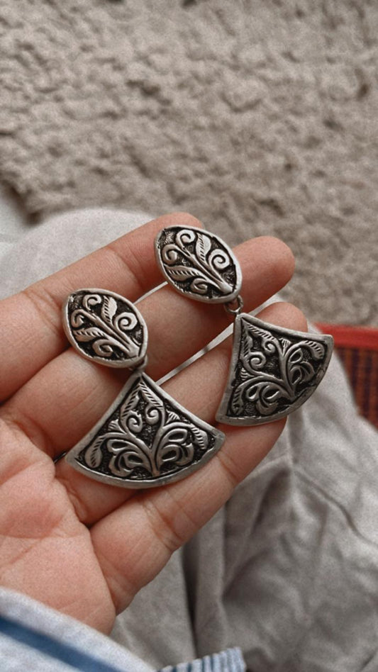 Handcrafted antique Chitai silver earrings with intricate detailing.