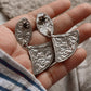 Vintage-style Chitai silver earrings with a unique handcrafted design.