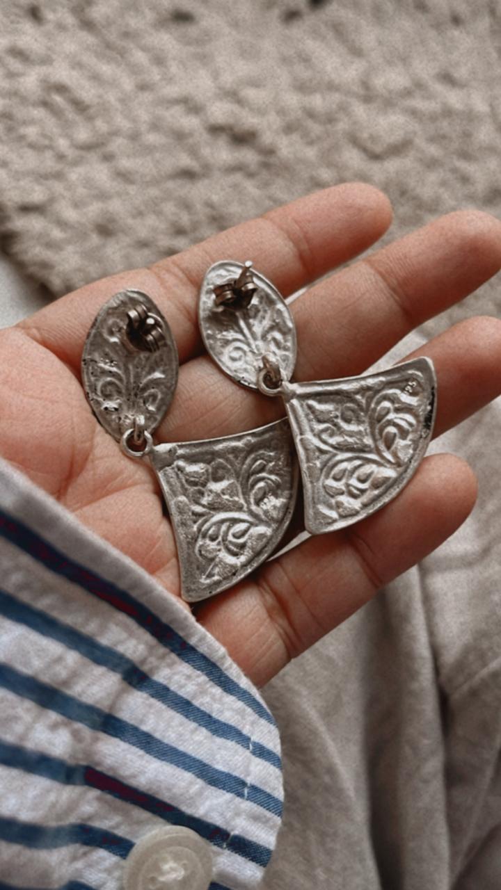 Vintage-style Chitai silver earrings with a unique handcrafted design.