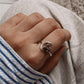 Garnet moon-shaped silver ring with an adjustable band
