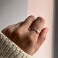 Stylish arrow band silver ring with a sleek design.