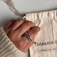 Detailed view of handcrafted chunky twist braided silver ring