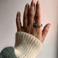 Close-up of chunky twist braided silver ring with adjustable band