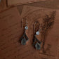 Elegant silver earrings featuring aqua chalcedony pear cut and blue topaz stones.