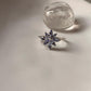 Elegant tanzanite floral ring in sterling silver