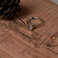 Delicate rose quartz oval ring with intricate tribal engravings in silver