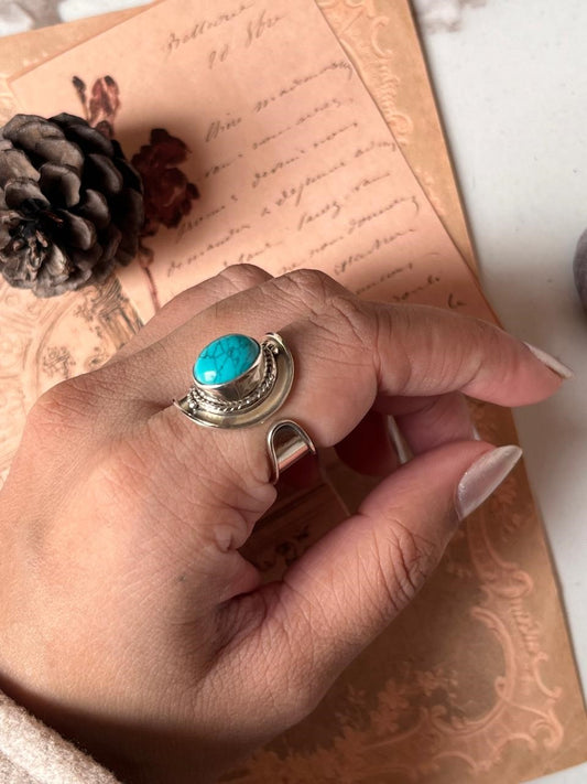 Boho-style faux turquoise adjustable silver ring with intricate detailing