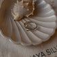 Close-up of dolphin silver ring with smooth, refined details