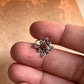 Tribal-inspired silver nose pin featuring pink CZ stone and wired back design