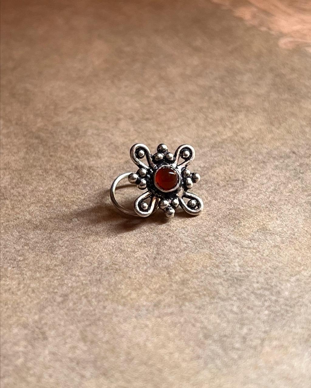 Close-up of Tribal Rawa pink cubic zirconia nose pin in 925 sterling silver