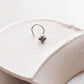 Tribal-inspired silver nose pin featuring flower design with wired back
