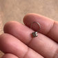 Elegant flower-shaped silver nose pin with tribal rawa design and wired back