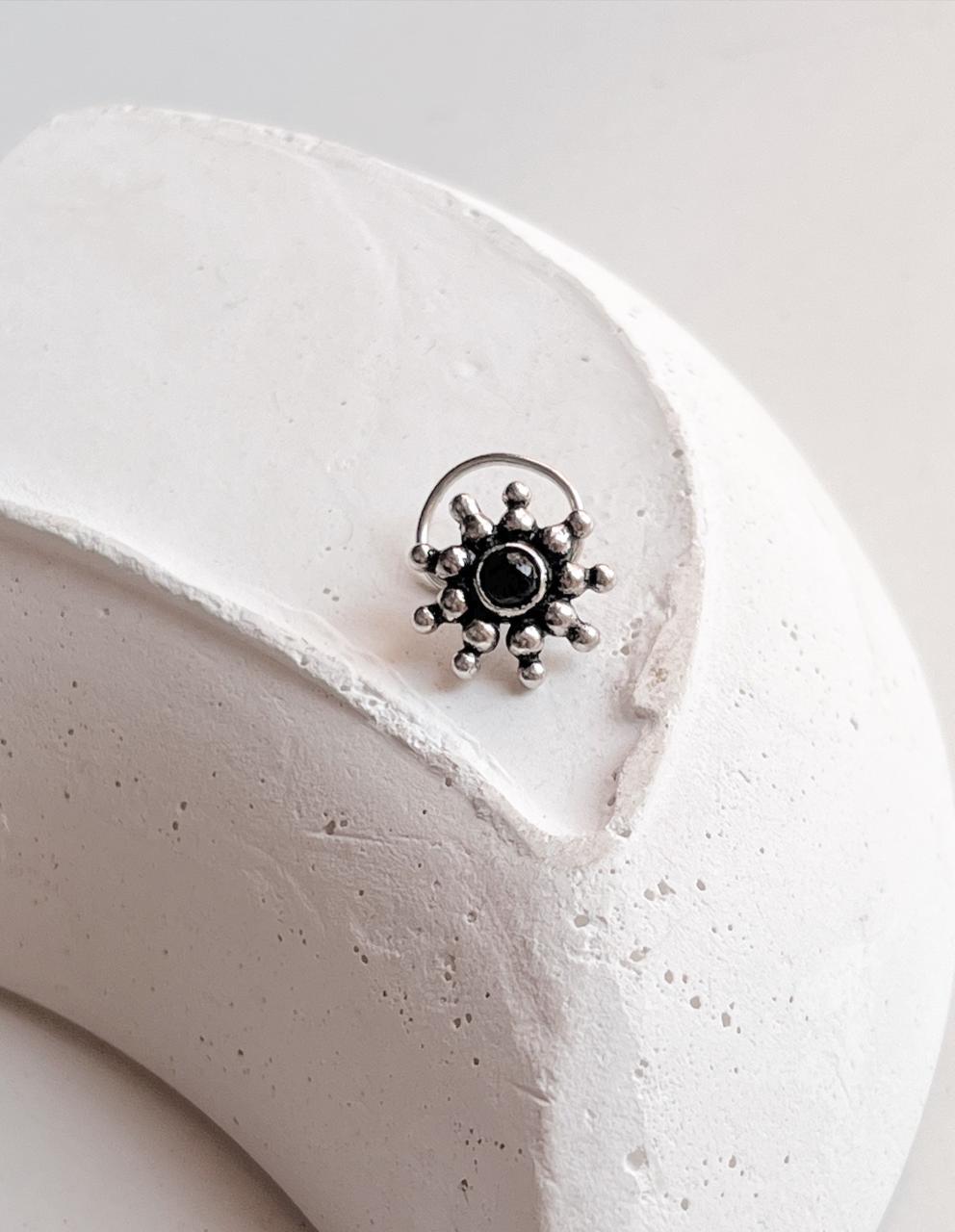 Tribal-inspired silver nose pin featuring black onyx stone and mandala design