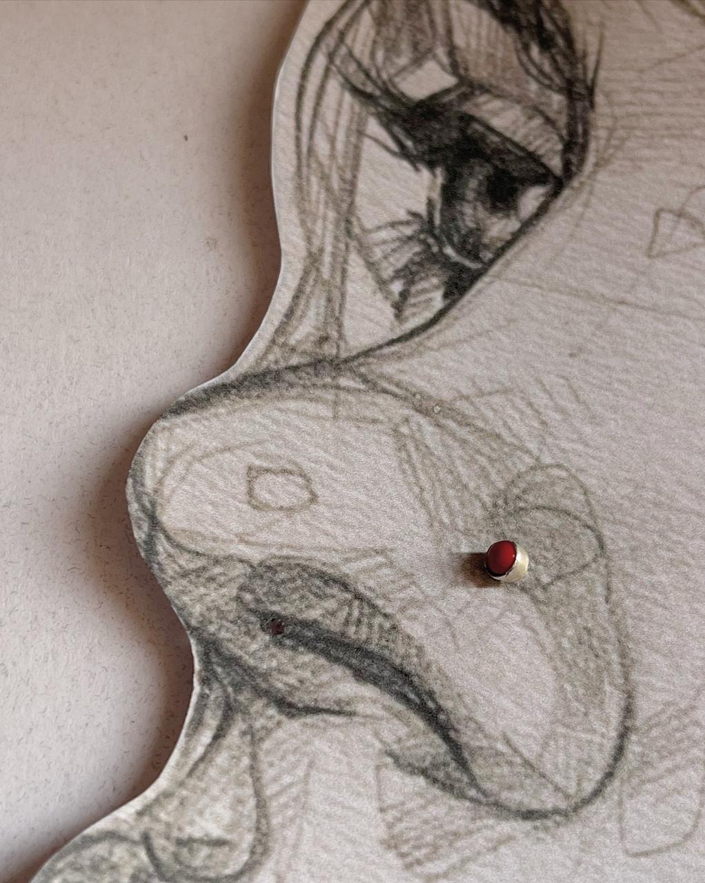 Close-up of red onyx nose pin in 925 sterling silver with screw back