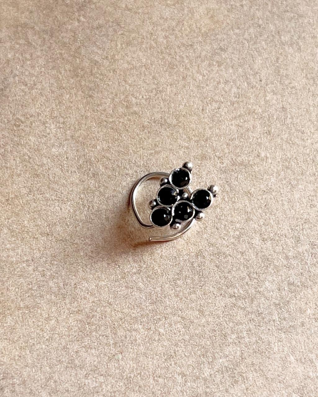 Close-up of Tribal Rawa Black CZ Stone Silver Nose Pin with wired back design