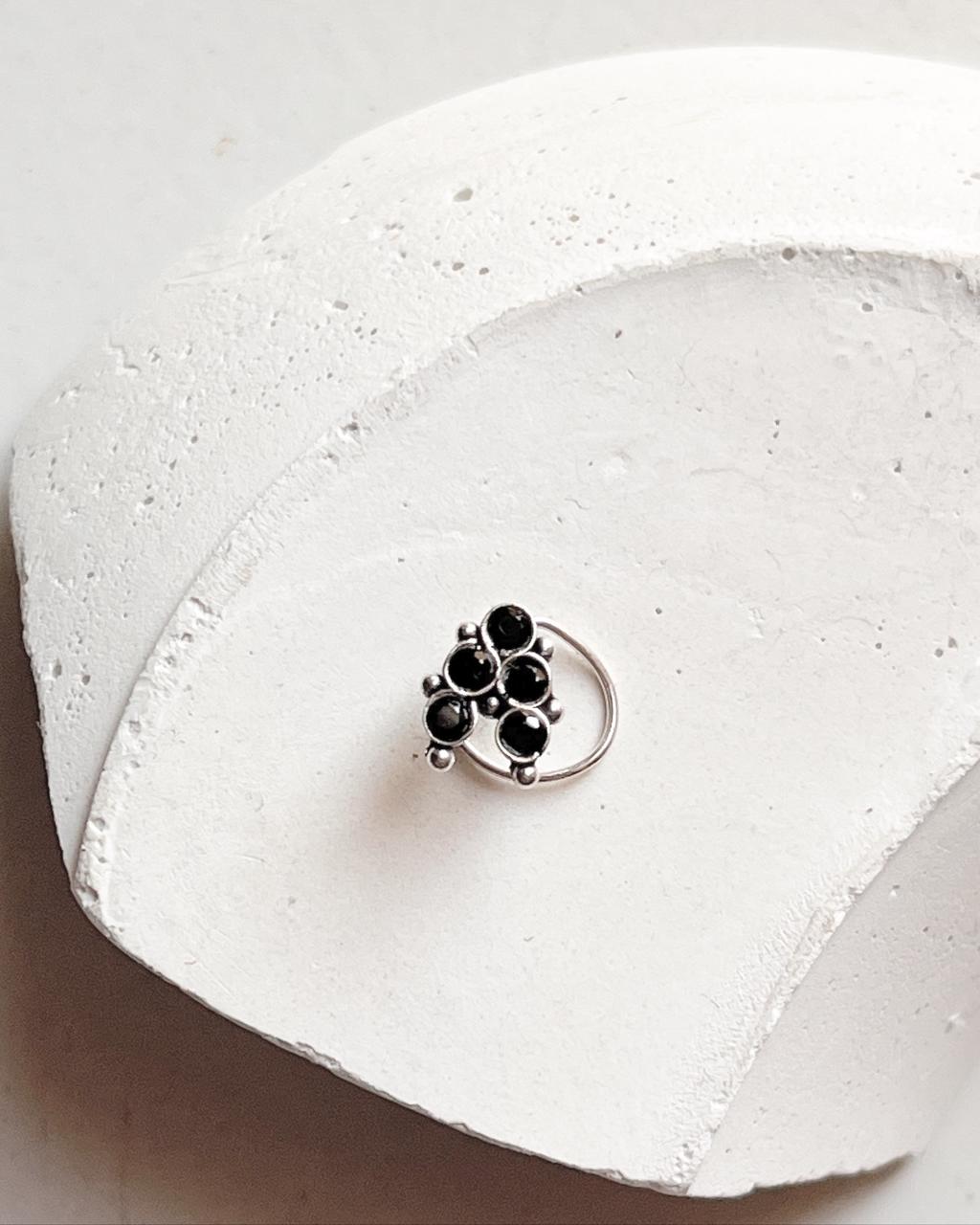Handcrafted silver nose pin with black cubic zirconia and tribal rawa motif