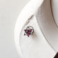 Handcrafted silver nose pin with pink cubic zirconia and floral tribal pattern