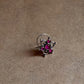 Close-up of Tribal Rawa Floral Pink CZ Stone Nose Pin with wired back design