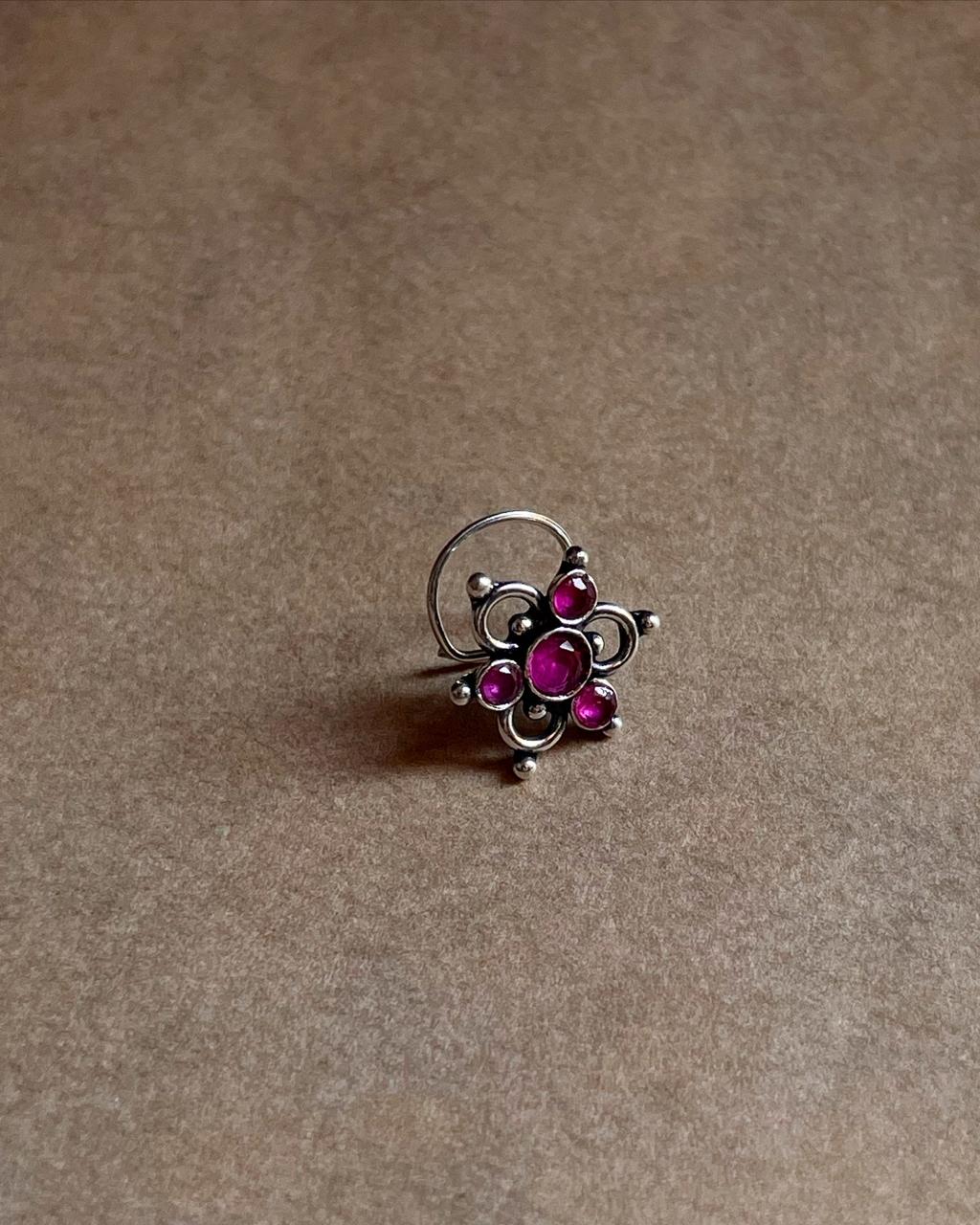 Close-up of Tribal Rawa Floral Pink CZ Stone Nose Pin with wired back design