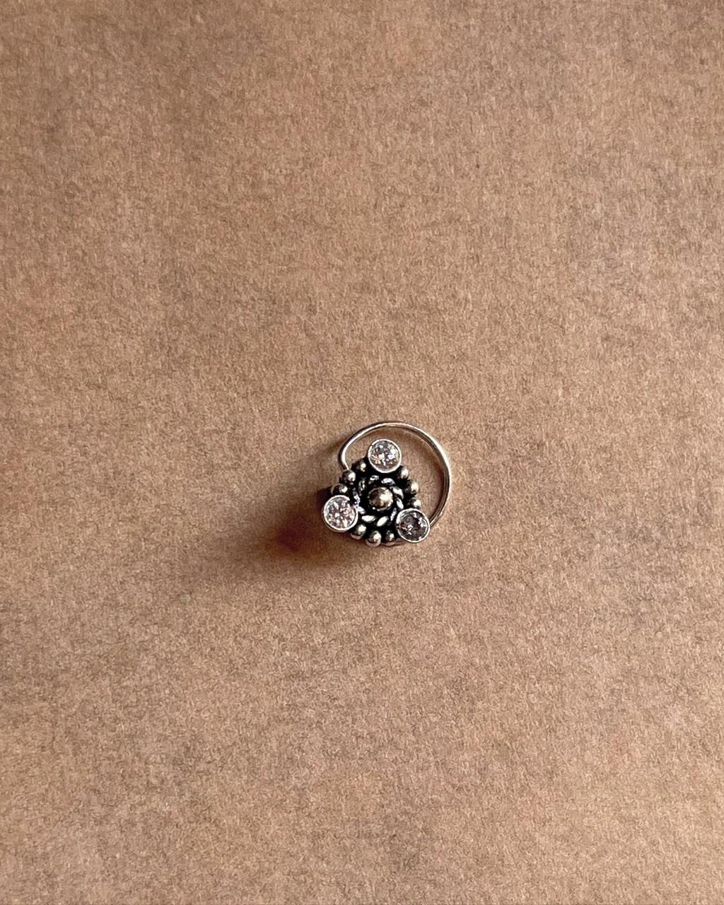 925 sterling silver nose pin with white CZ gemstone and tribal rawa pattern