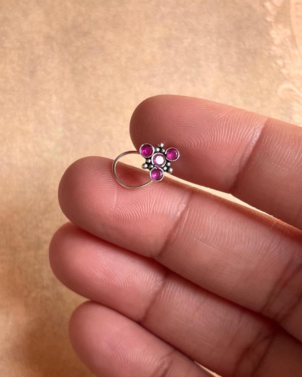 Close-up of Tribal Rawa Pink CZ Stone Silver Nose Pin with detailed design