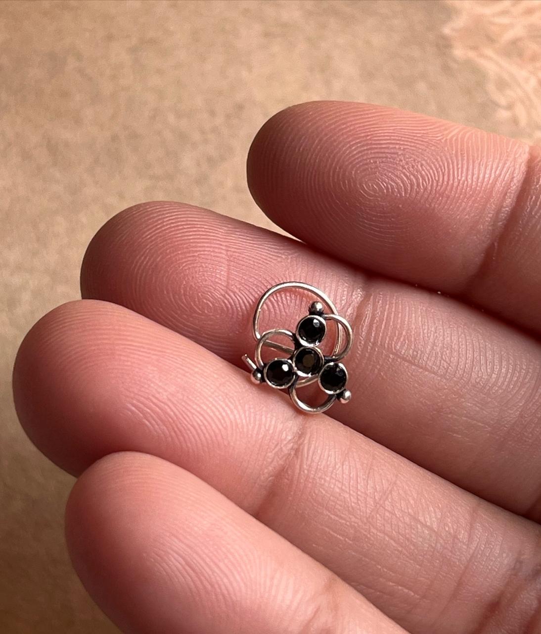 Close-up of Tribal Rawa Black CZ Stone Silver Nose Pin with unique wired back design