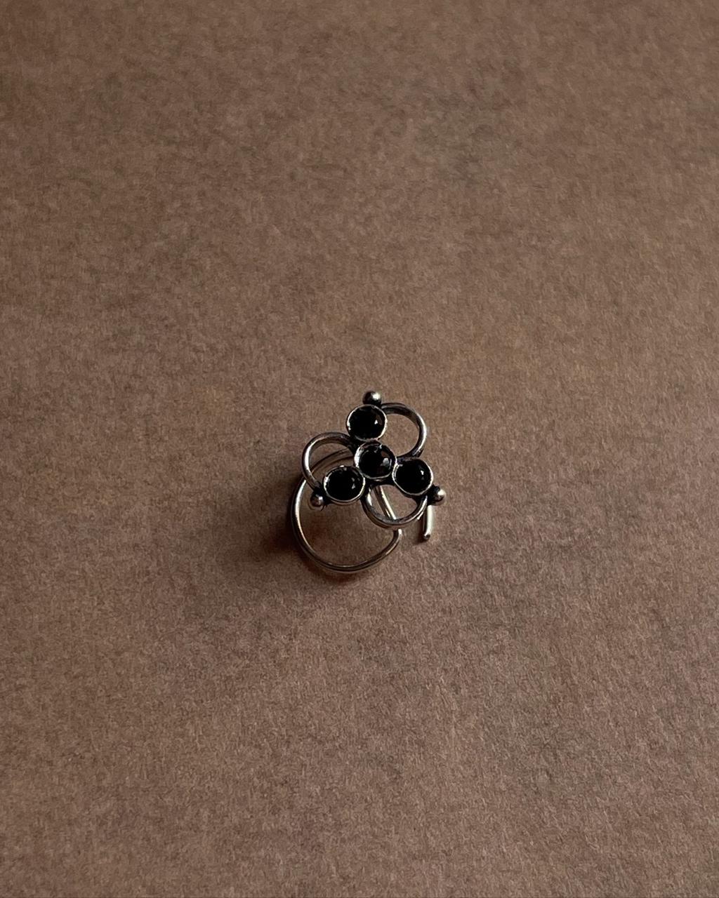 Handcrafted silver nose pin with black cubic zirconia and tribal rawa motif