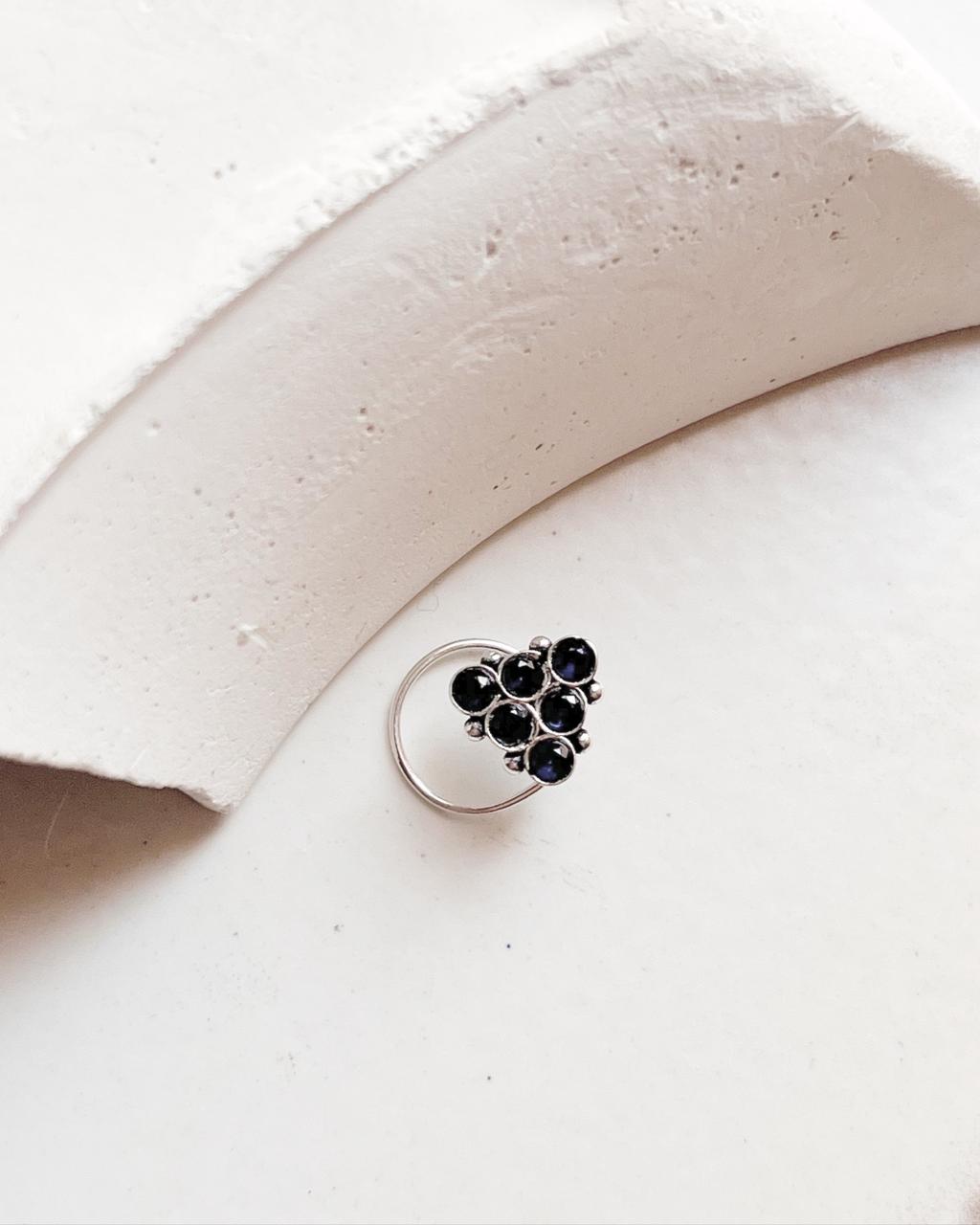 Close-up of Tribal Rawa Blue CZ Stone Silver Nose Pin with wired back design