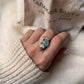 Aquamarine, blue topaz, and moonstone gemstone cluster ring in sterling silver