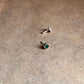 Close-up of Green CZ Screw Back Minimal Silver Nose Pin