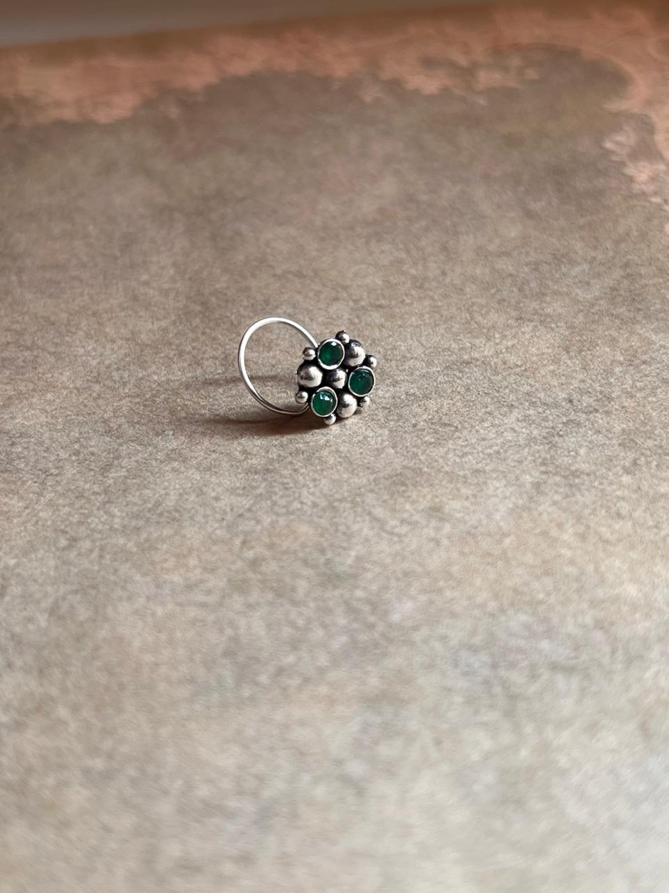 Handcrafted tribal rawa nose pin with green CZ stone in 925 silver