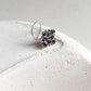 Tribal-style silver nose pin featuring blue CZ stone and wired back