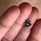 Tribal-style silver nose pin featuring green CZ stone and wired back