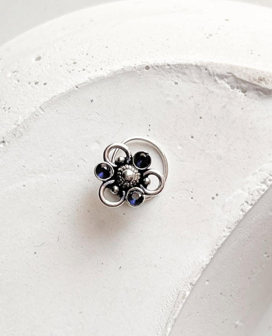 Tribal-style 925 sterling silver nose pin featuring blue CZ stone and wired back