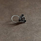 Tribal-style silver nose pin featuring black CZ stone and wired back