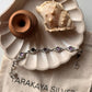Handcrafted boho silver bracelet featuring round amethyst flower