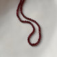 Close-up of Garnet 2MM Round Faceted Crystal Necklace