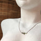 Close-up of multi Green Tourmaline pear crystals set in 925 sterling silver necklace