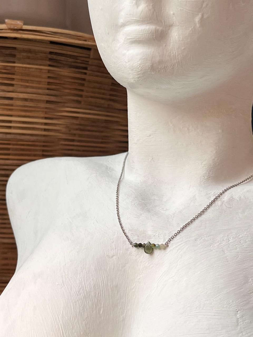 Close-up of multi Green Tourmaline pear crystals set in 925 sterling silver necklace