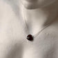 Close-up of Garnet Heart Pendant Necklace in Sterling Silver