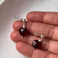 Close-up of Garnet Heart and Pearl Crystal Silver Stud Earrings