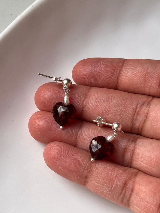 Close-up of Garnet Heart and Pearl Crystal Silver Stud Earrings