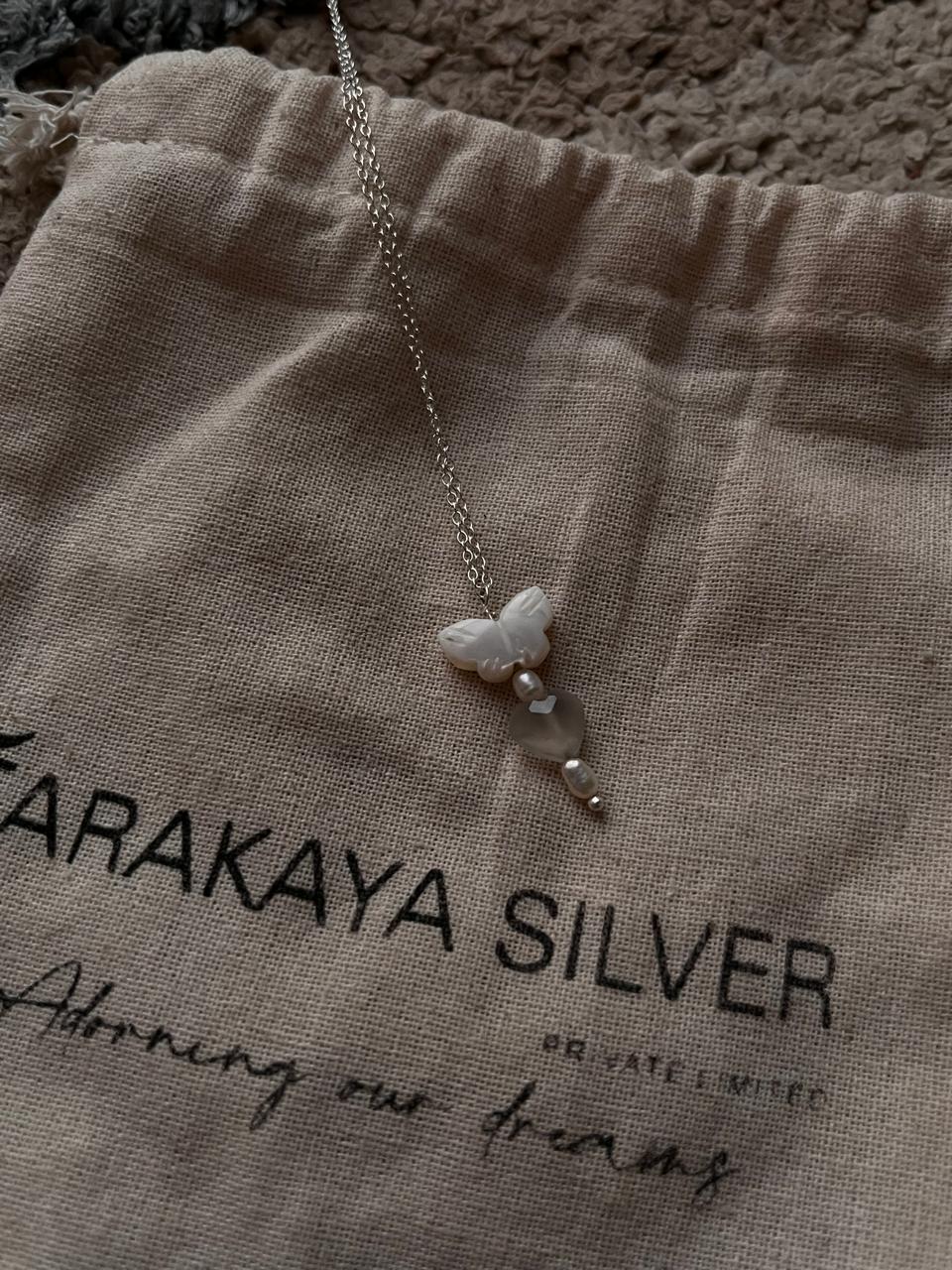 Crystal silver necklace featuring Mother of Pearl butterfly, Grey Moonstone heart, and Fresh Water Pearls
